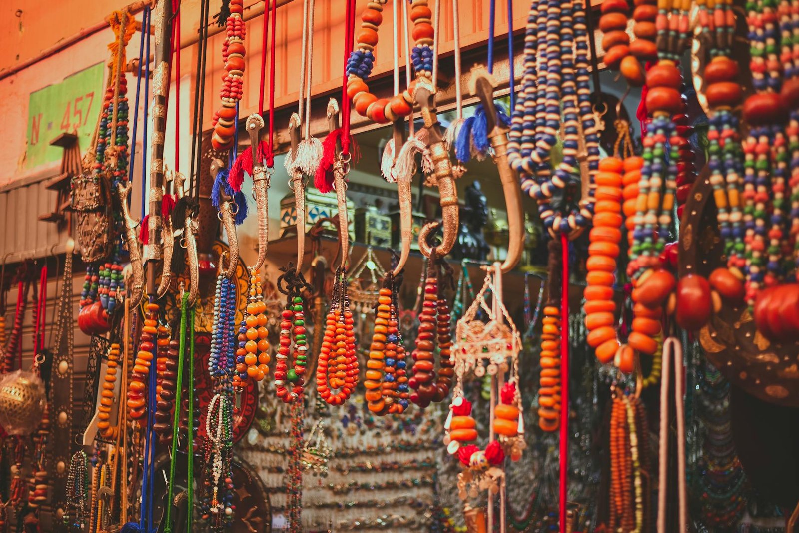 Colorful assortment of traditional Moroccan beads and crafts displayed in a market in Agadir, Morocco.
