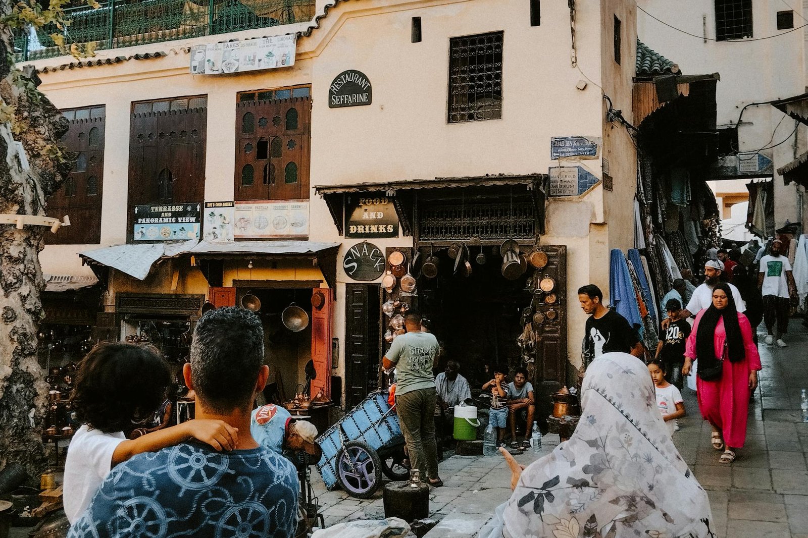 Lively street scene in Fes Medina, showcasing traditional Moroccan culture and architecture.