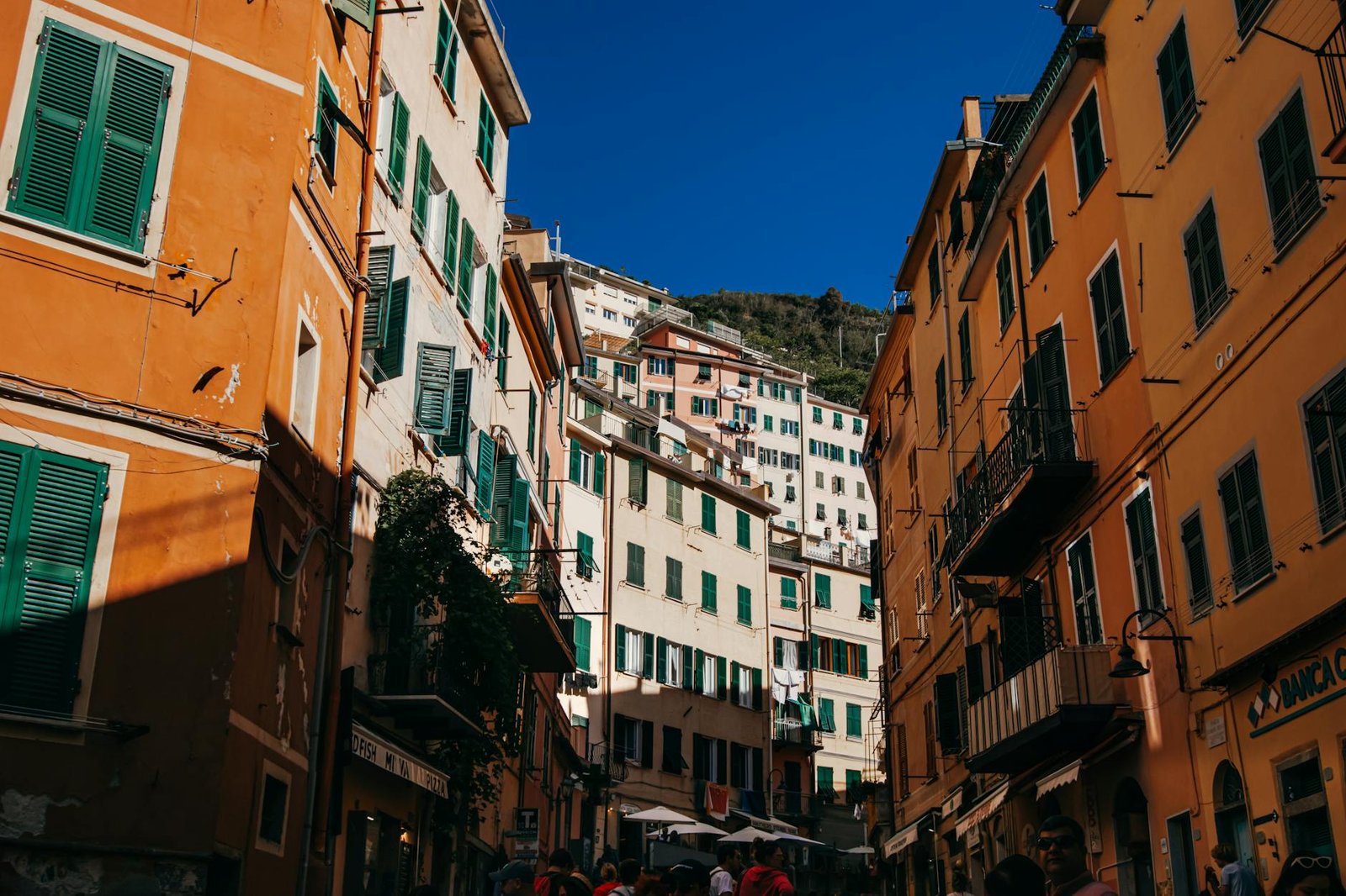 A vibrant street scene in a historic Italian town with warm-hued buildings and bustling energy.