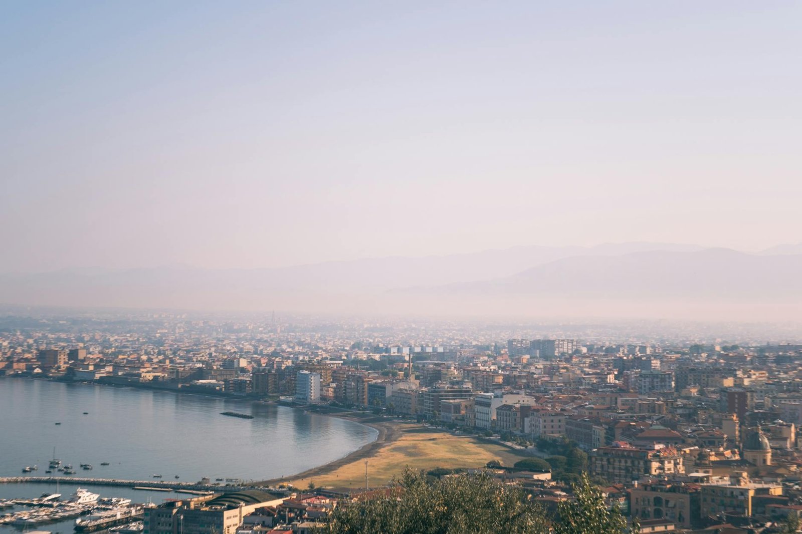 Stunning aerial view of Castellammare di Stabia, Italy with its vibrant coastline and urban landscape.