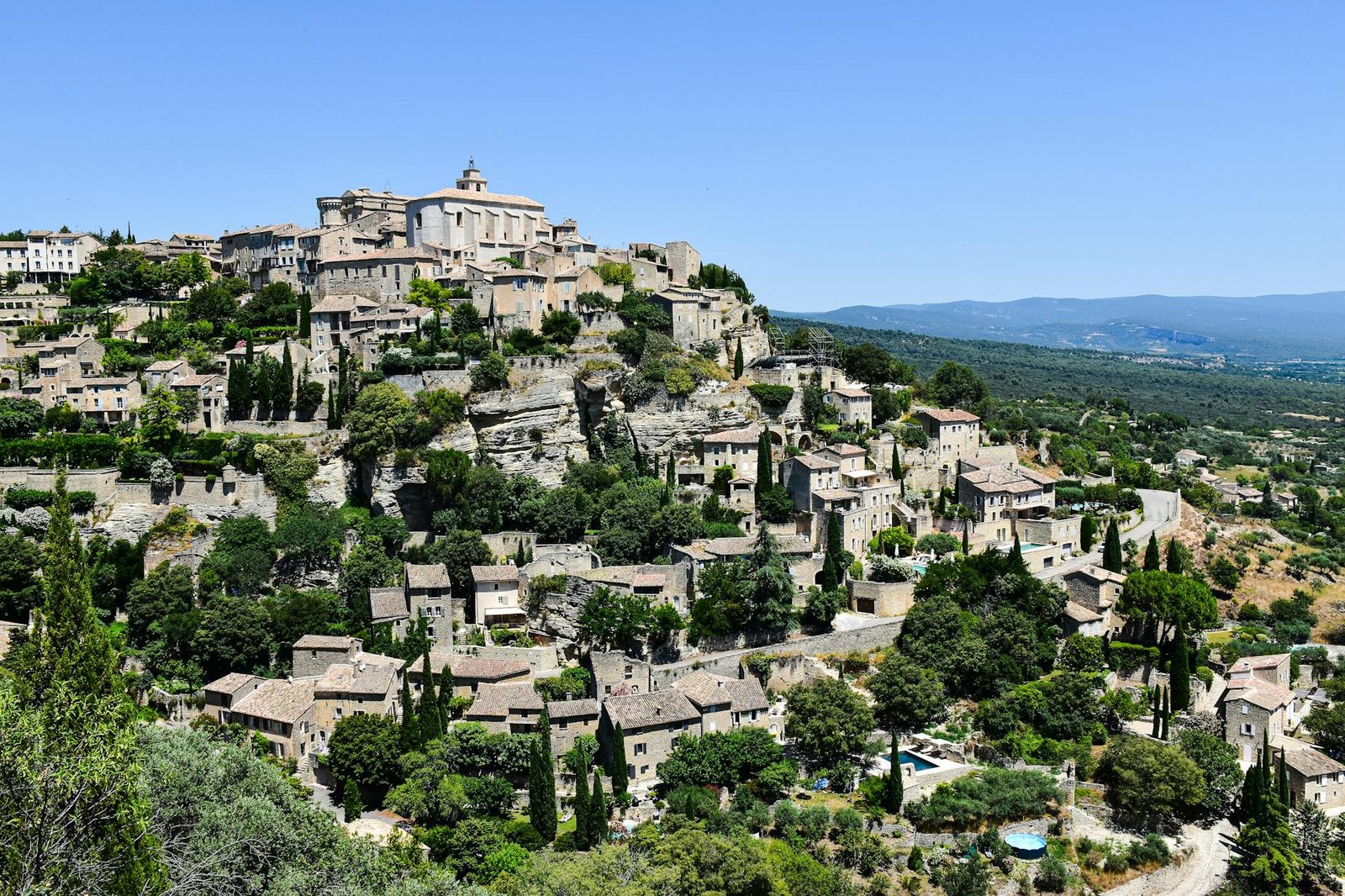 A picturesque view of Gordes village on a sunny day in Provence-Alpes-Côte d'Azur, France.